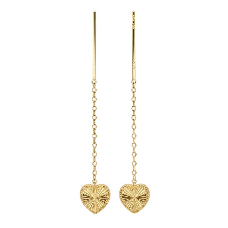 Gold heart-shaped earrings on a white background