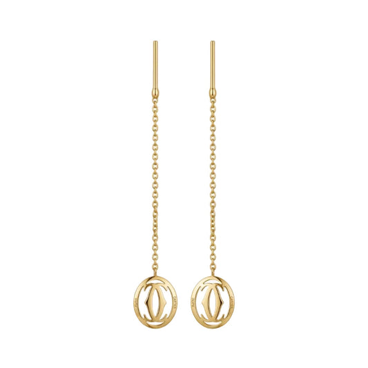 Gold earrings with chain designs on a white background
