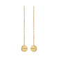 Gold earrings with round pendants on thin chains against a white background