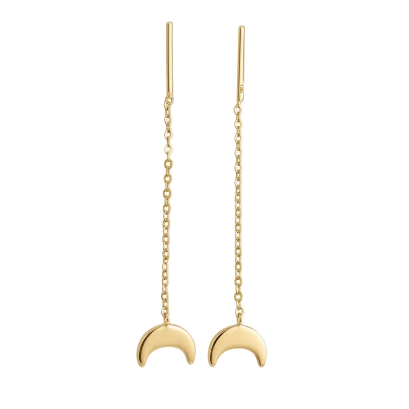 Gold necklace with a crescent moon pendant on a white background
