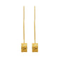 Gold earrings with square designs on a white background