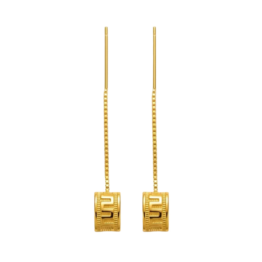 Gold earrings with square designs on a white background