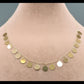 Gold bracelet on a mannequin with weight and code information displayed.