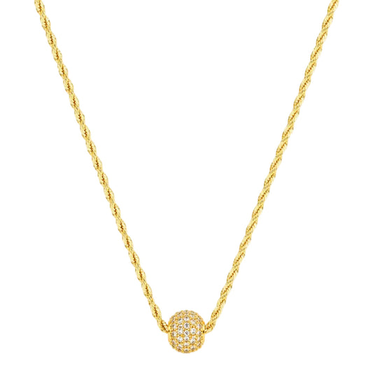 Gold necklace with a spherical pendant on a white background