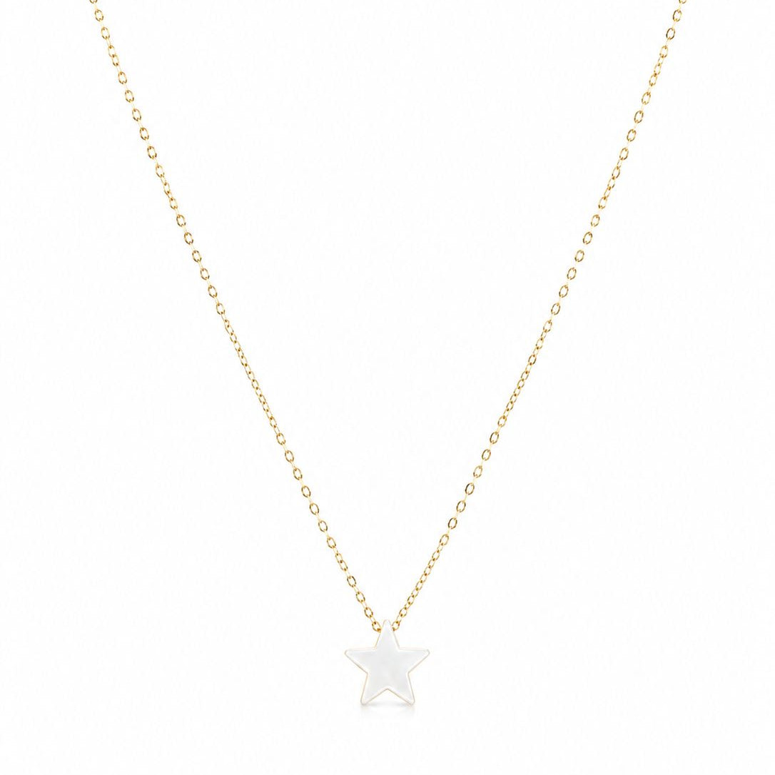 Gold necklace with a star-shaped pendant on a white background