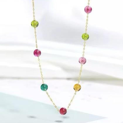 Necklace with colorful beads on a white background