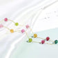 Necklace with multicolored beads on a light background