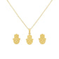 Gold hamsa hand necklace and earrings on a white background