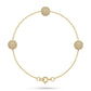 Gold bracelet with spherical beads on a white background