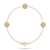Gold bracelet with spherical beads on a white background