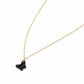 Black butterfly pendant on a gold chain against a white background