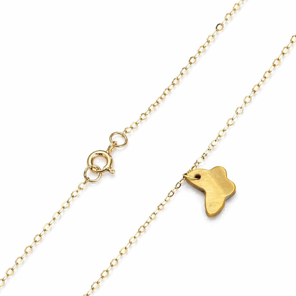 Gold necklace with a small pendant on a white background