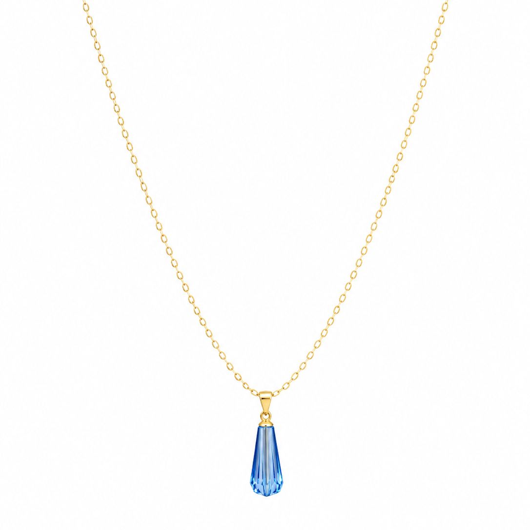 Gold necklace with a blue teardrop pendant on a white background