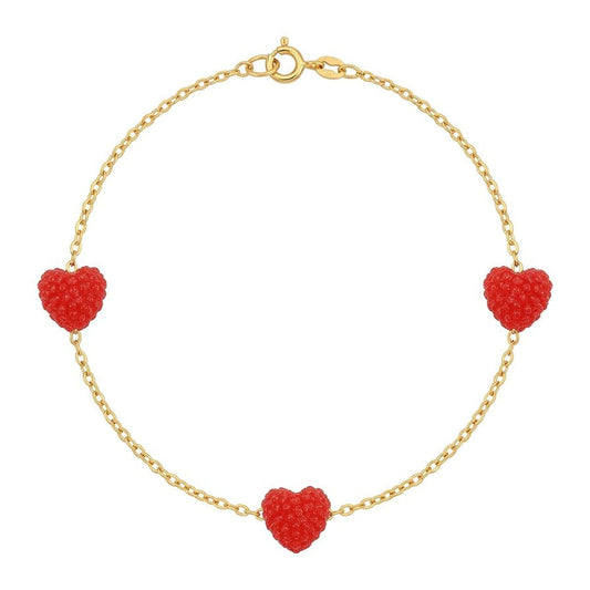 Gold bracelet with red heart-shaped charms on a white background
