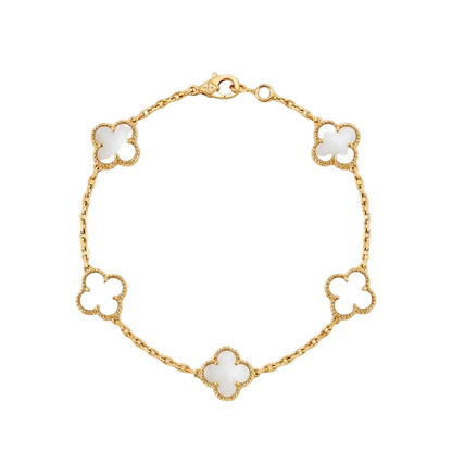 Gold bracelet with white clover-shaped charms on a white background