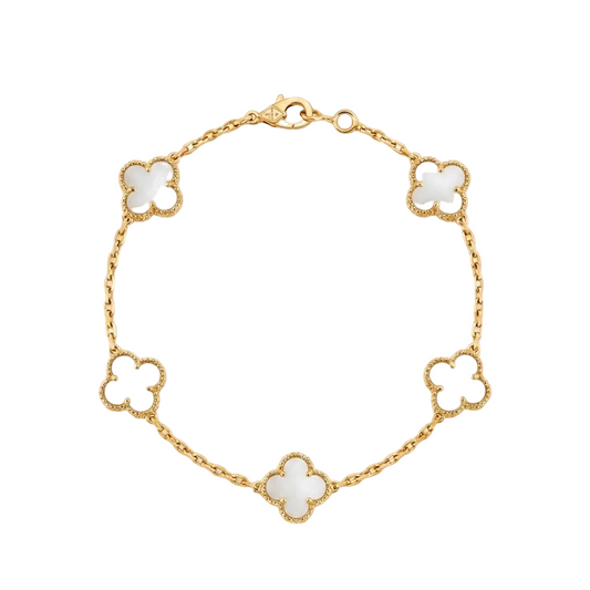 Gold bracelet with white clover-shaped charms on a white background