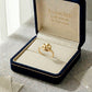 Gold ring in an open jewelry box with 'Embellish Gold Jewelry & Diamond' branding.