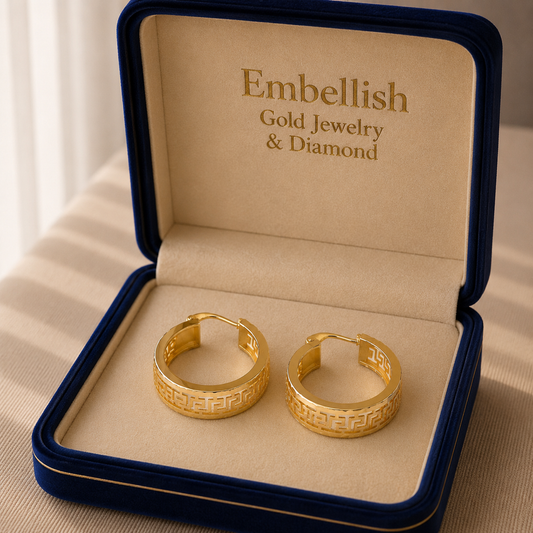 Gold hoop earrings in a 'Embellish Gold Jewelry & Diamond' box.